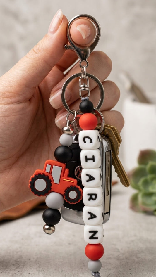Personalised silicone bead name charm for kids' bags and keys, featuring stylish pastel beads and a durable metal lobster clasp, handmade in Ireland.
