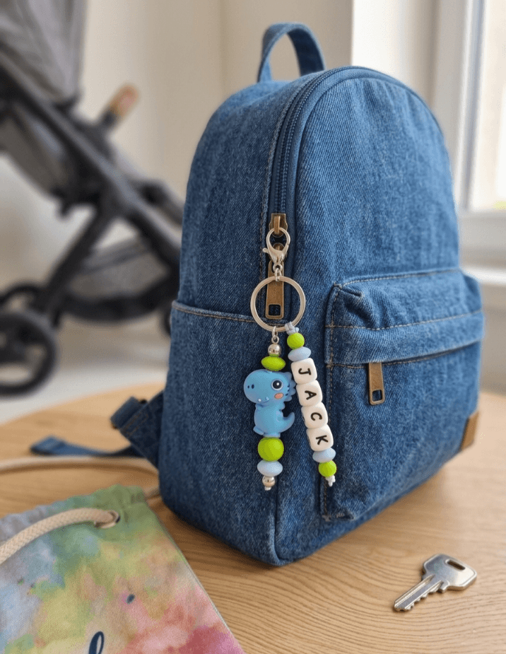 Handmade phone charm featuring polished black onyx and purple amethyst gemstone beads on a durable cord, styled on a smartphone for protection and spiritual aesthetic.