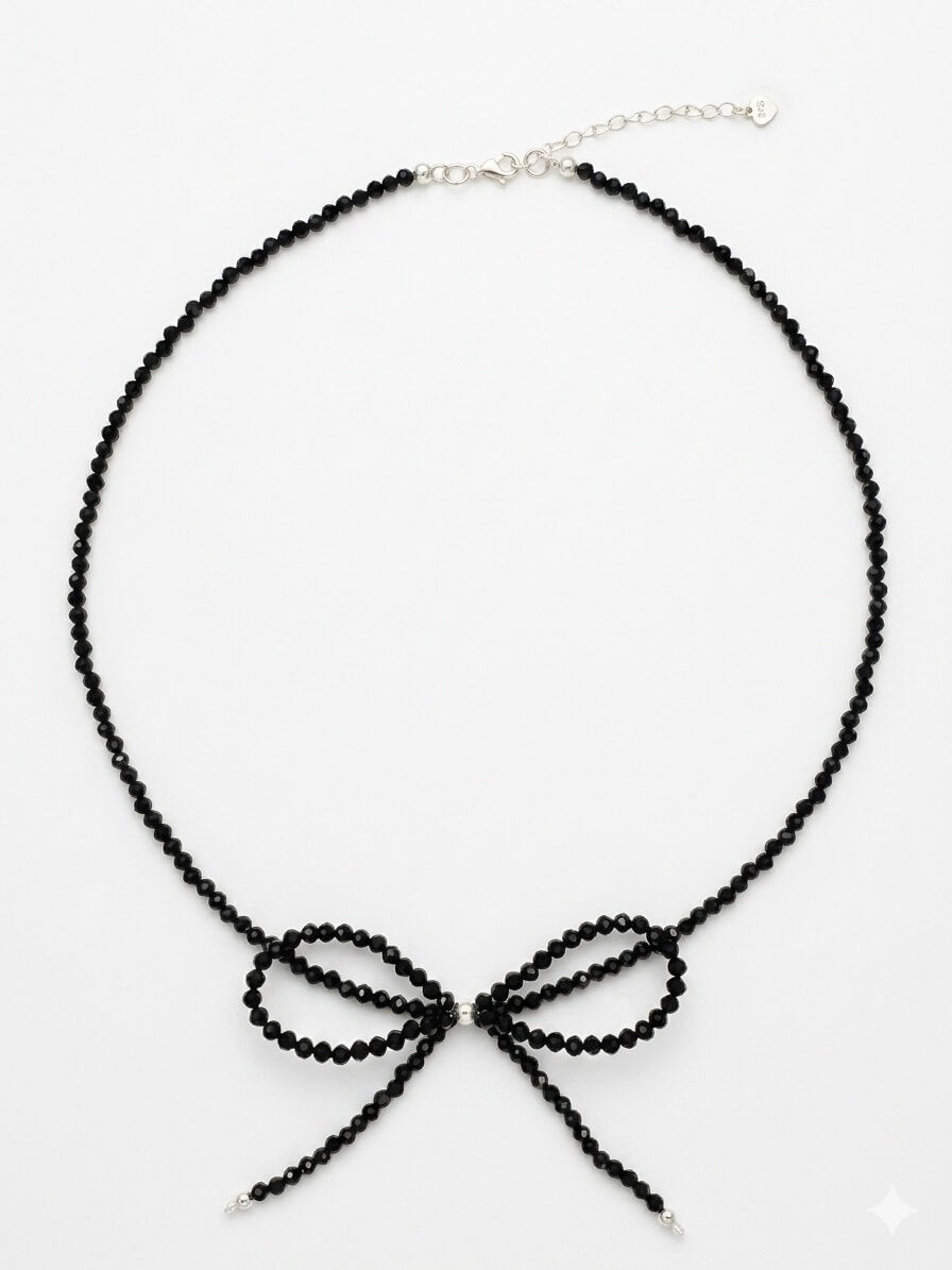 Handmade black tourmaline choker necklace with a delicate beaded bow and 925 sterling silver finish.