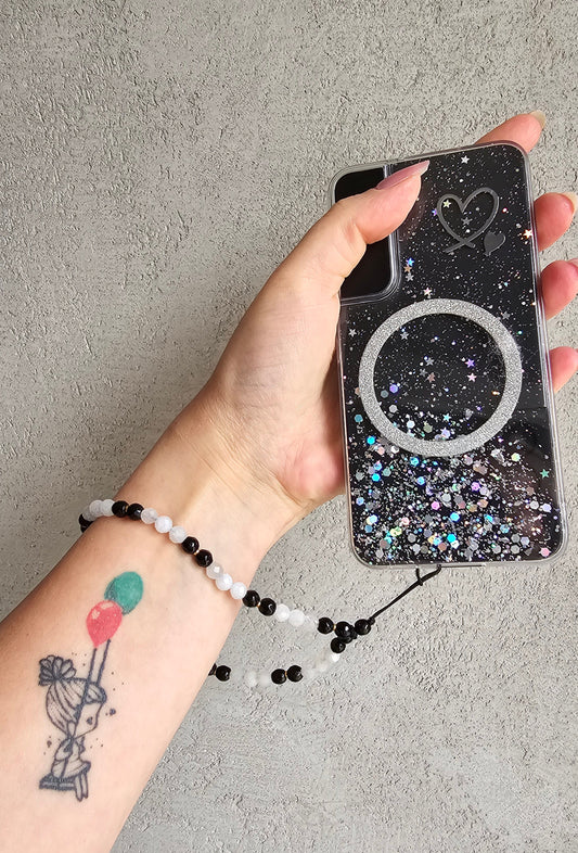 protective crystal charm with black onyx & moonstone. Calming, fidget-friendly and perfect for your phone, keys, or bag. Handmade with meaning.
