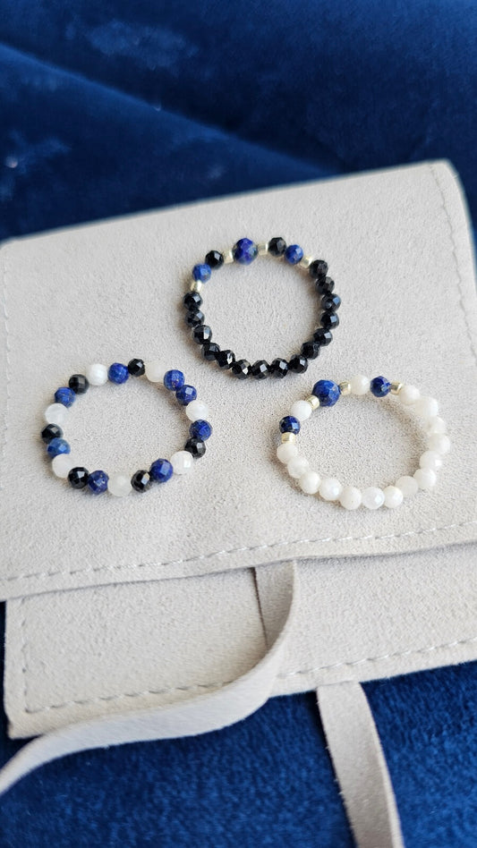 Close-up of Cosmic Trinity elastic ring with 3mm Lapis Lazuli, Black Tourmaline, and Moonstone natural beads.