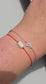 Handmade stacking bracelet set featuring a natural Moonstone red string protection bracelet with 925 sterling silver beads and a delicate crescent moon charm chain bracelet in solid 925 silver.

💡