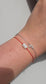 Handmade stacking bracelet set featuring a natural Moonstone red string protection bracelet with 925 sterling silver beads and a delicate crescent moon charm chain bracelet in solid 925 silver.

💡