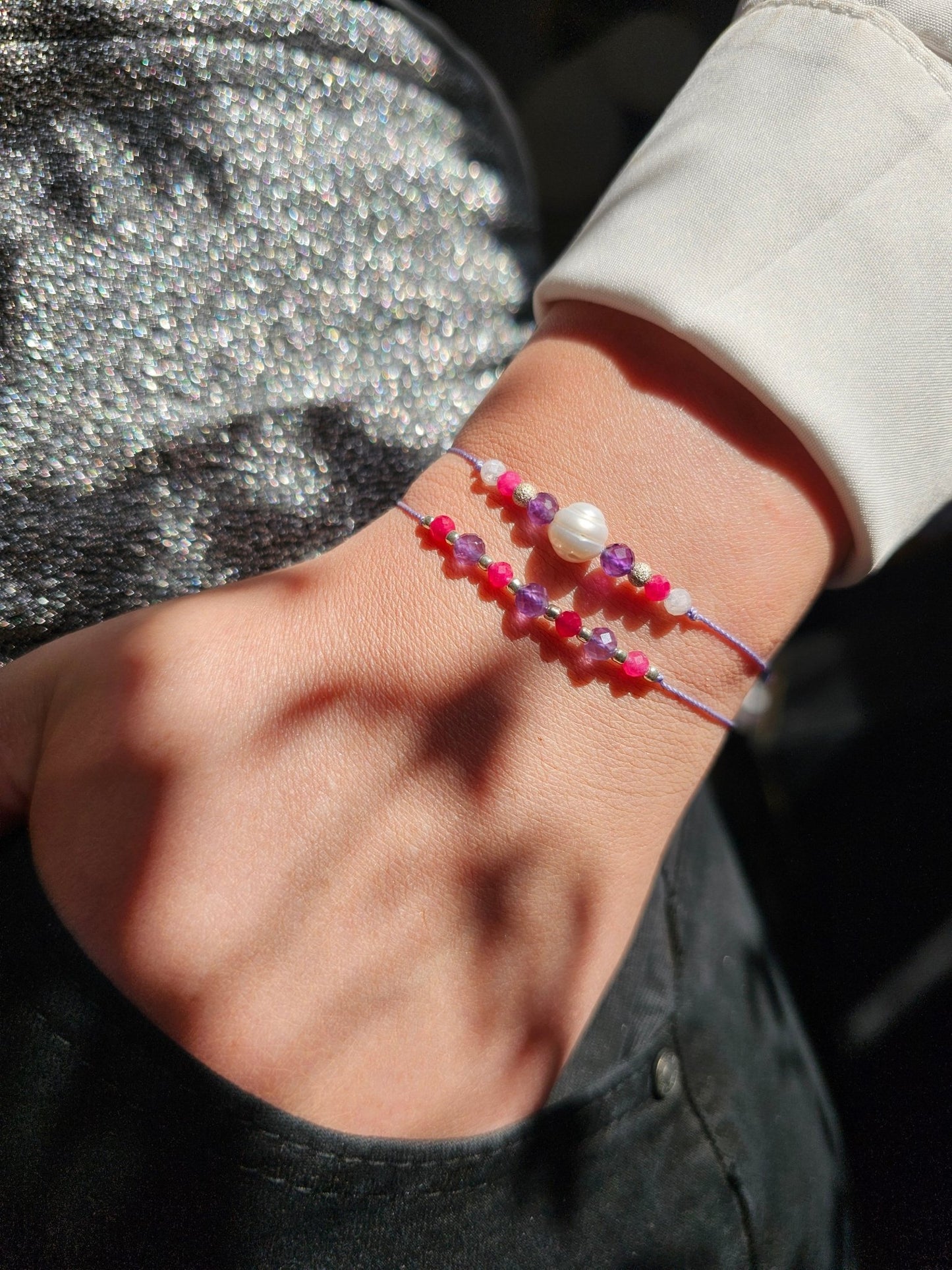 Handmade amethyst and quartz bracelet with sterling silver details. Natural gemstone jewelry for calm, balance, and positive energy. Adjustable fit, crafted in Ireland.


