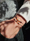 Handmade citrine and onyx bracelet with sterling silver beads. Adjustable cord for comfort. Natural gemstone jewelry promoting positivity, strength, and balance.