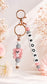 Pastel silicone bag charm with pink bear, beads and rose gold details

