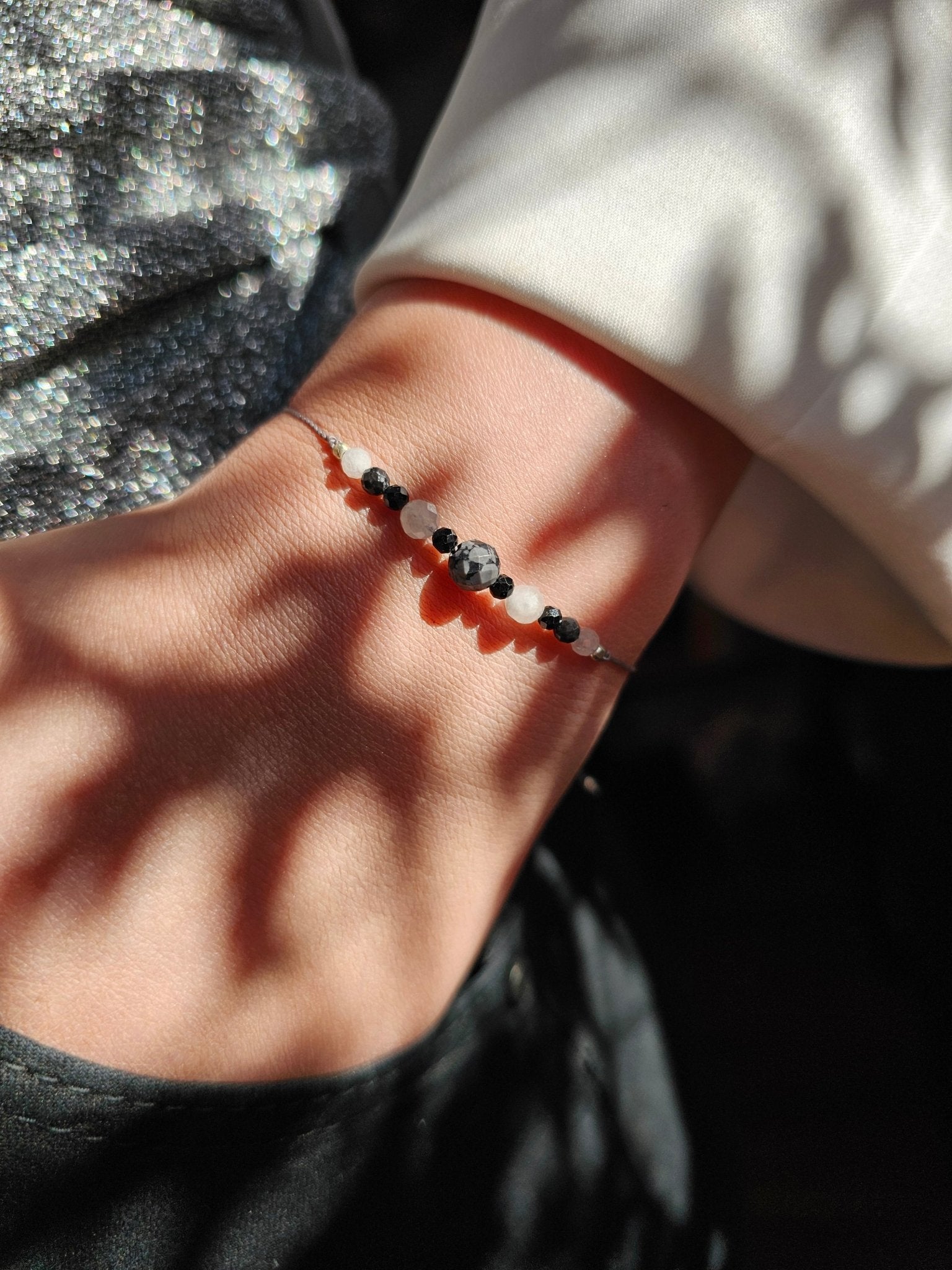 Matching friendship bracelets with Snowflake Obsidian and Tourmaline beads