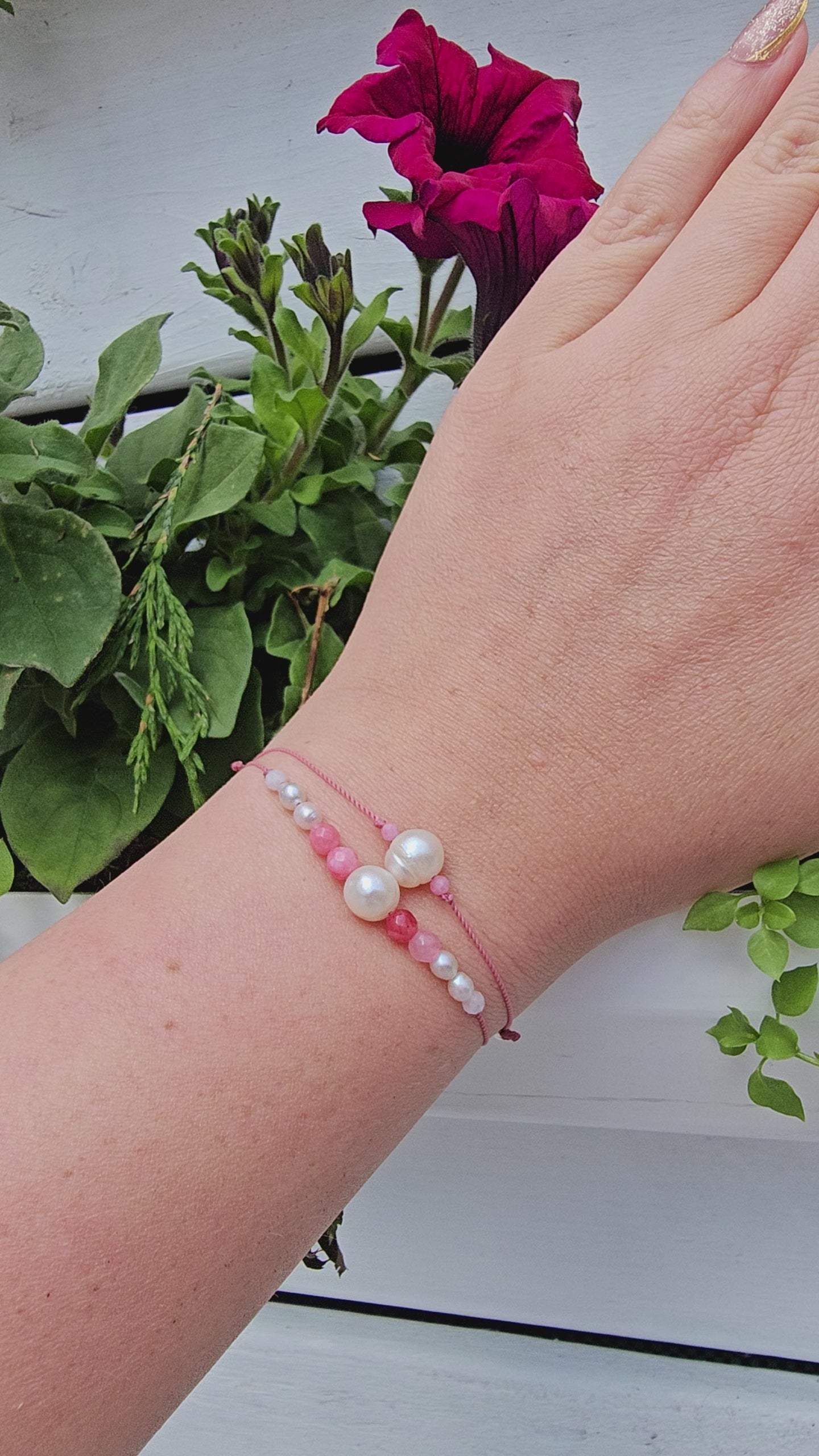 Bracelet with natural freshwater pearls, pink chalcedony, and moonstone on a pink cord from The Strawberry Collection.