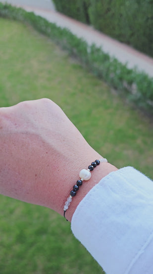 Handcrafted gift-ready bracelet with pearls, moonstone, and protective onyx stones.