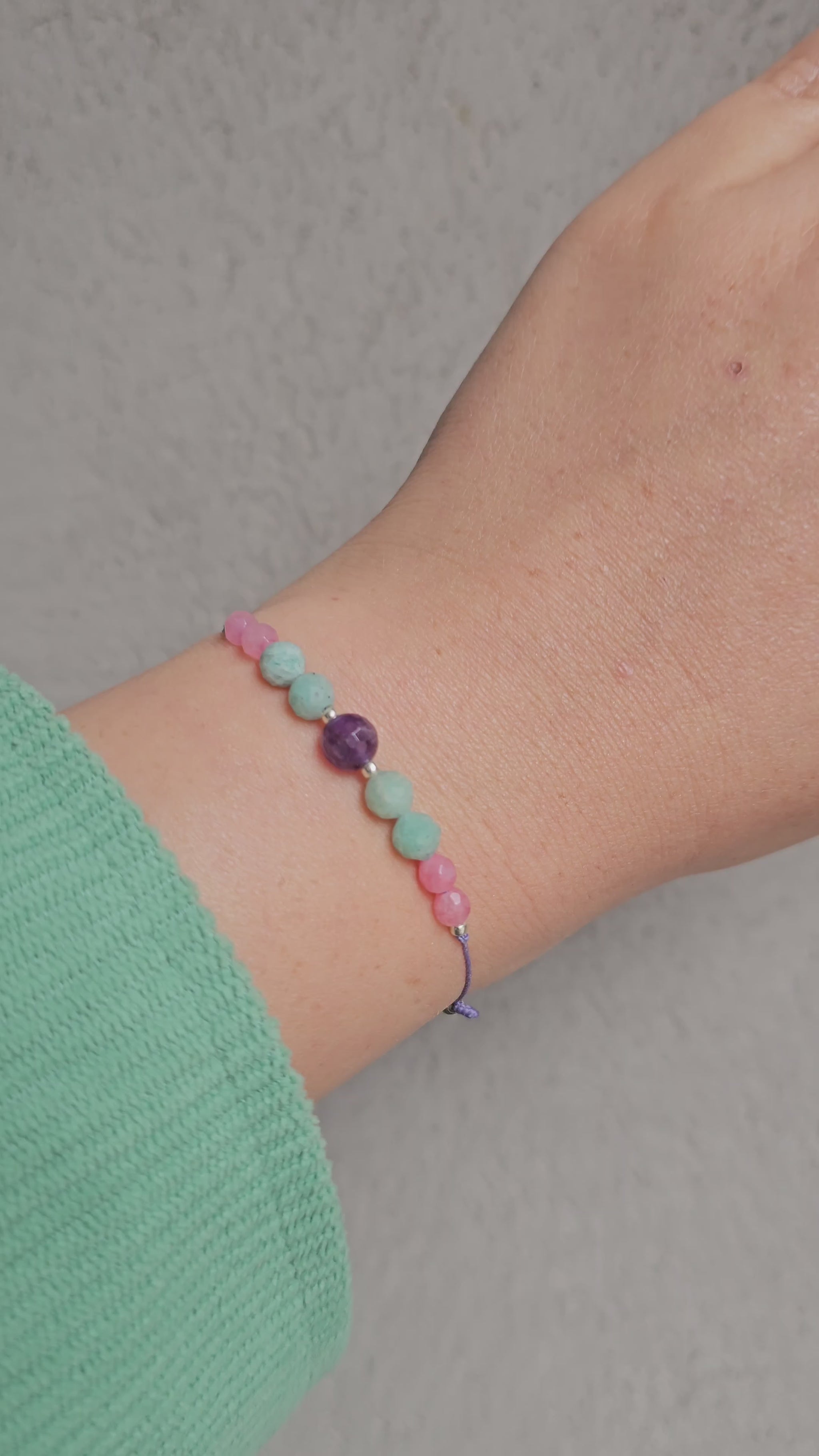 Luminous Serenity adjustable bracelet with amazonite, amethyst, and pink chalcedony beads and sterling silver accents
Handmade adjustable gemstone bracelet with silver Toho beads and natural stones
Close-up of colourful amazonite, amethyst & pink chalcedony bracelet with adjustable cord