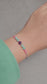 Luminous Serenity adjustable bracelet with amazonite, amethyst, and pink chalcedony beads and sterling silver accents
Handmade adjustable gemstone bracelet with silver Toho beads and natural stones
Close-up of colourful amazonite, amethyst & pink chalcedony bracelet with adjustable cord