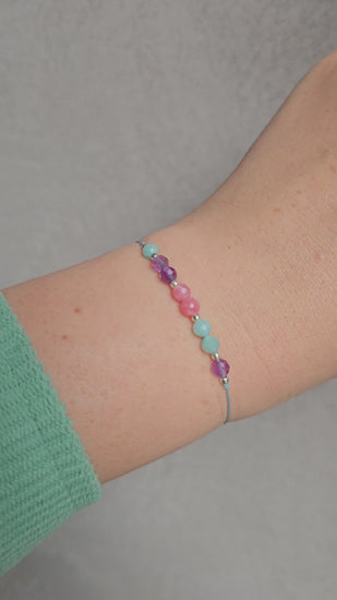 Adjustable bracelet with amazonite, amethyst, and pink chalcedony gemstones, silver Toho beads – handmade Irish jewellery
Close-up of handmade gemstone bracelet with sterling silver Toho beads and adjustable cord
Elegant adjustable bracelet featuring amazonite, amethyst & pink chalcedony beads, sterling silver accents

