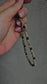 Natural crystal charm with black onyx and dalmatian jasper beads on a cord – grounding, protective and calming gemstone accessory.