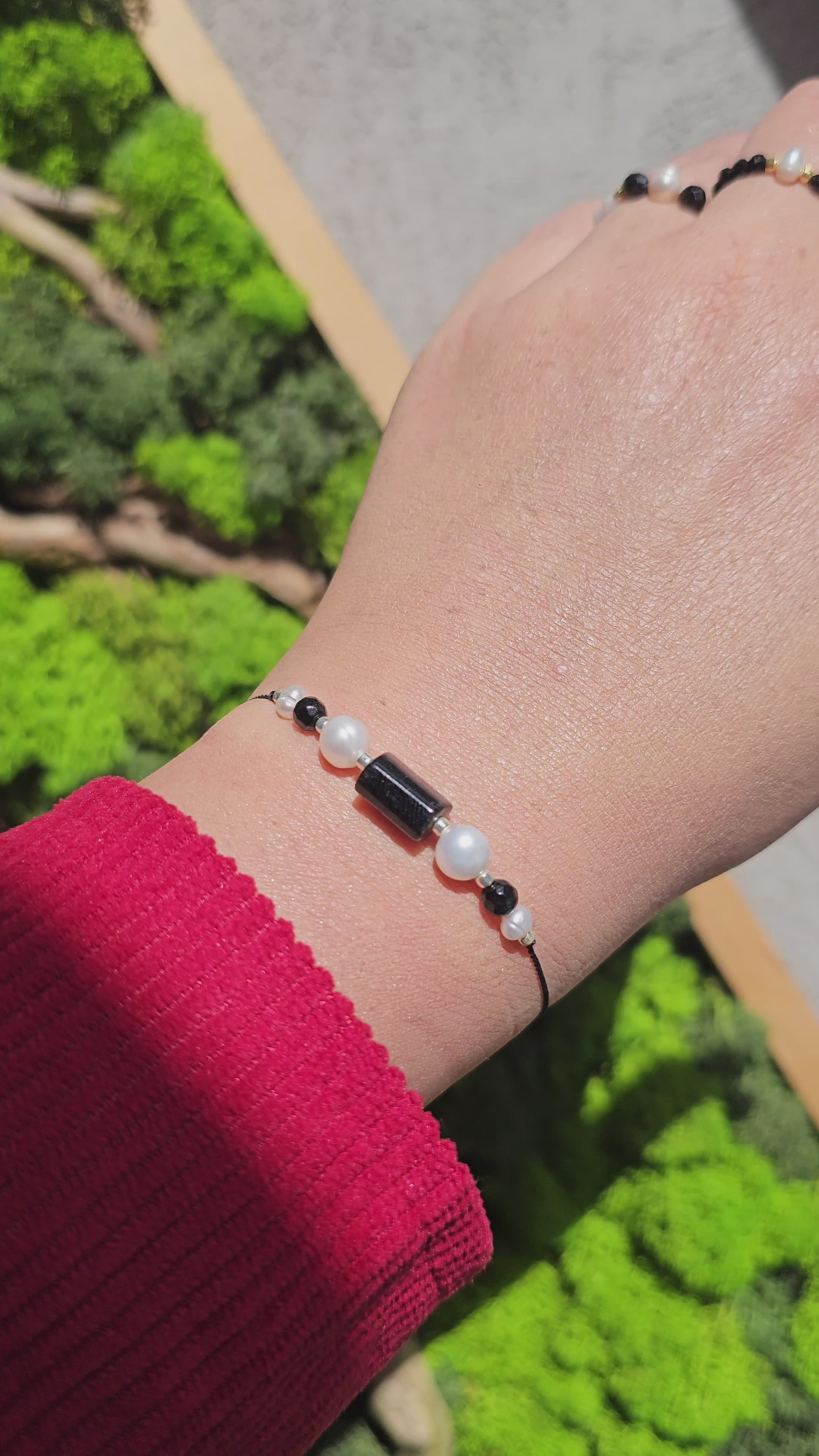 Gift-ready bracelet with pearls, onyx, and black tourmaline beads on elegant black cord.