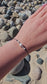 Handmade Scorpio zodiac bracelet with labradorite and moonstone
Astrology jewellery gift for Scorpio woman
Adjustable silk cord bracelet with sterling silver and gemstones
Spiritual Scorpio bracelet with tourmaline and pearl
Elegant handmade zodiac jewellery for October and November birthdays
