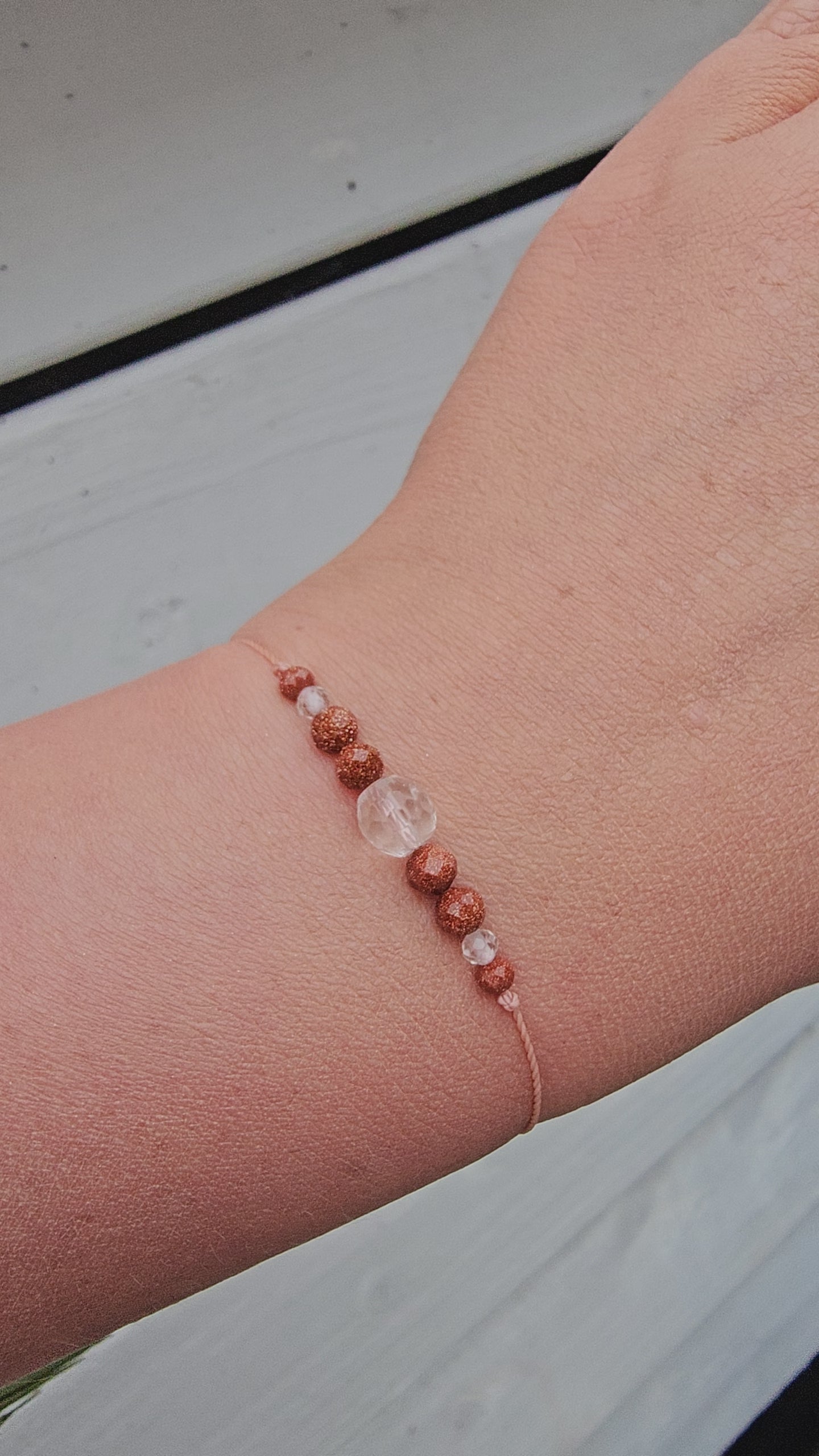 Viral crystal bracelet made with clear quartz and natural sandstone, handmade in Ireland. Minimalist, earthy jewellery with calming energy.