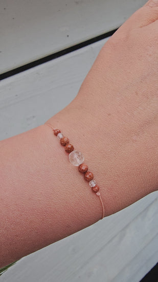 Viral crystal bracelet made with clear quartz and natural sandstone, handmade in Ireland. Minimalist, earthy jewellery with calming energy.
