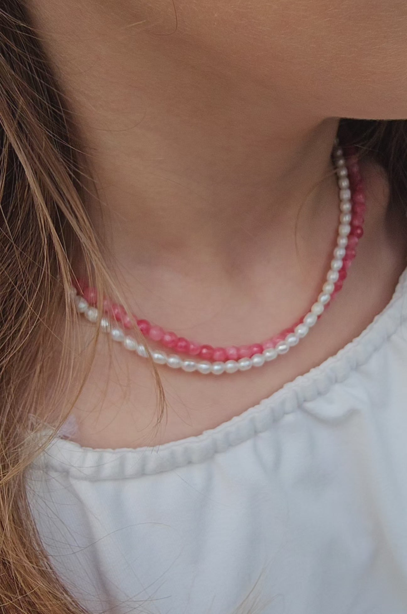 Double-layer choker with freshwater pearls and pink chalcedony on a pink cord from The Strawberry Collection, featuring a 925 sterling silver clasp.